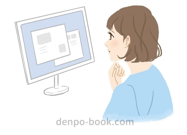 「パソコンを見て電報を考える女性」のイメージ画像